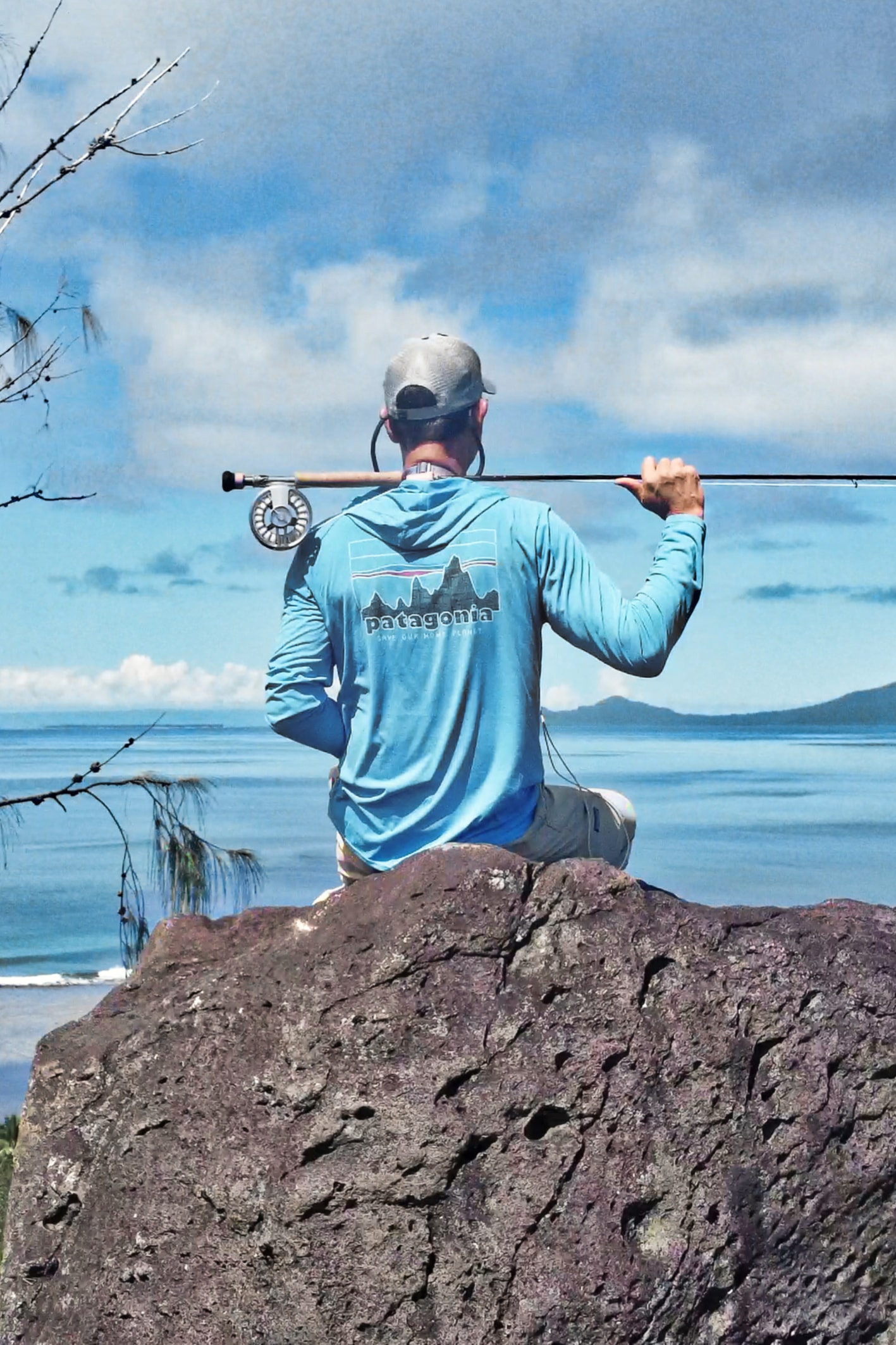 Fly fisherman with rod tropical destination